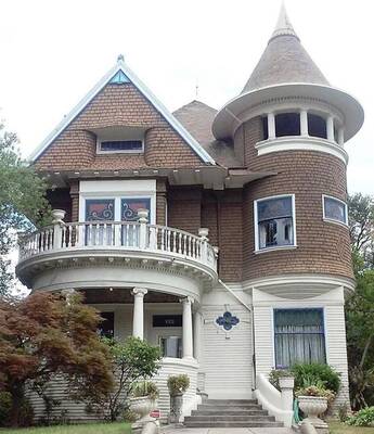 Victorian House with Contrasting Facade and Corner Tower