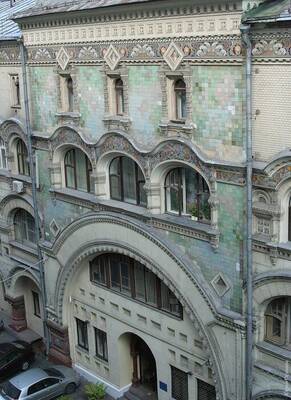 Art Nouveau Mosaic Facade: A Symphony of Arches, Textures, and Color