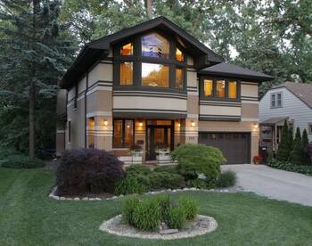 Modern two-story house with an expressive facade in natural tones