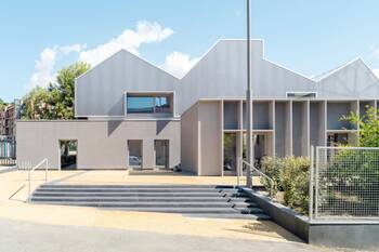 Contemporary minimalist facade with contrasting finishes and industrial aesthetics