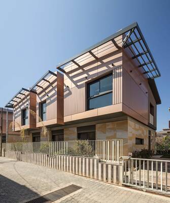 Modern Two-Level Facade with Wooden Panels and Integrated Sun Protection