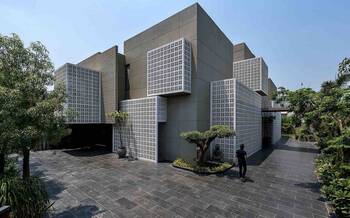 Modern House with Perforated Façade: Balance of Aesthetics and Functionality