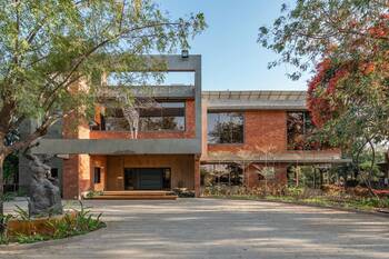 Modern Brutalist Facade with Contrasting Concrete and Brick Combination