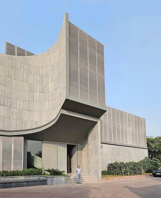 Perforated Concrete Façade: Brutalist Elegance in Contemporary Architecture