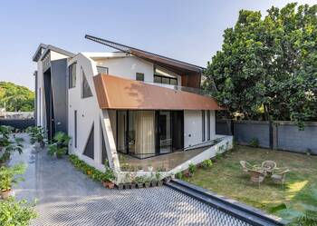 Modern house with dynamic facade and contrasting materials