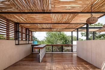 Tropical Minimalism: Open Terrace with Wooden Facade and Lattice Ceiling