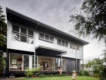 Modern two-story house with metal facade and panoramic glazing