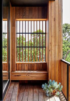 Cladding with balcony on house facade