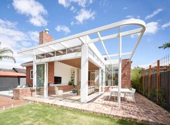 Modern facade with contrasting combination of brick and white frame