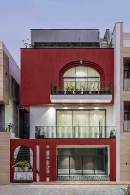 Vibrant Modern Facade with Arched Elements: Red and White Contrast