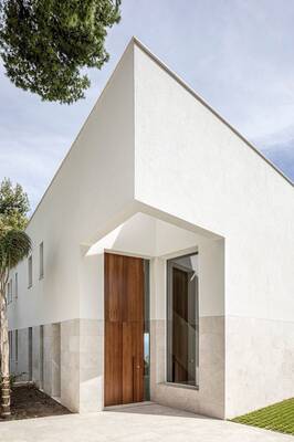 Cladding with doors on house facade