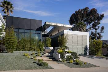 Modern Minimalist Facade with Contrasting Volumes and Expressive Canopy