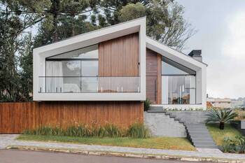 Minimalist facade with contrasting combination of wood and white plaster