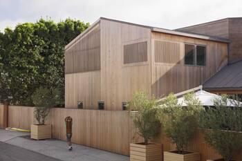 Modern wooden facade with vertical slats: harmony of form and functionality