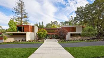 Modern Facade with Wood and Concrete Contrast in Harmony with Nature