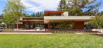 Modern country house with contrasting wood and plaster facade