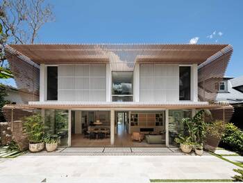 Modern Tropical House with Dual-Layer Wooden Facade