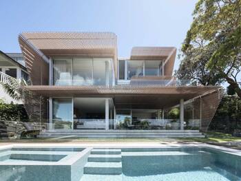 Modern house with lamella facade and panoramic glazing