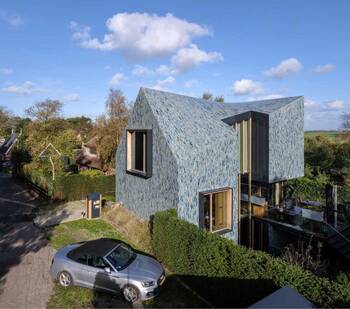 Modern house with mosaic facade and original geometry