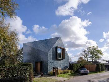 Modern House with Mosaic Blue Facade: Geometry and Texture in Residential Architecture