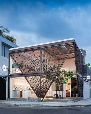 Modern pavilion with honeycomb-patterned perforated metal facade