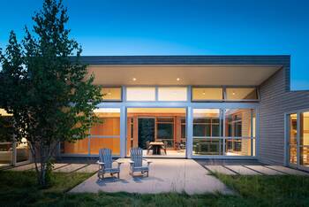 Modern Minimalist Facade with Panoramic Glazing and Wooden Cladding