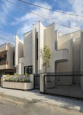 Vertical Undulating Facade: Modern House with Dynamic Architecture