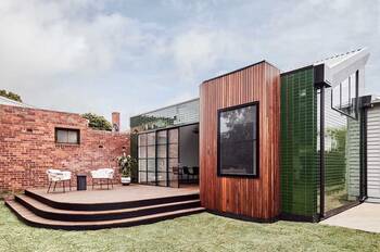 Contemporary Multi-Material Facade: Harmonious Blend of Wood, Tile and Brick in a Suburban Project