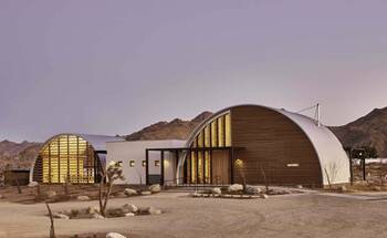 Desert Dome Facade: Harmony of Arched Forms and Contrasting Materials