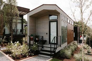 Modern modular house with contrasting wooden facade