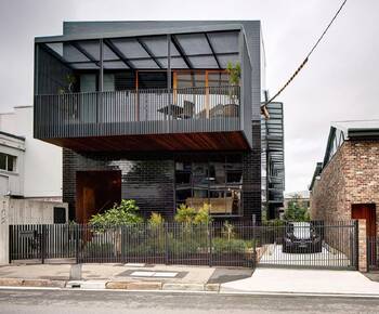 Modern urban house with industrial facade and cantilevered second floor