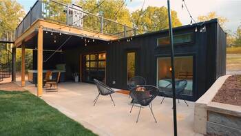 Modern Black Container Home Facade with Wooden Terrace