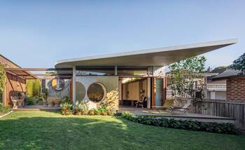 Modern house with porthole windows and floating facade