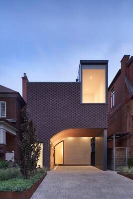 Minimalist Brick Facade with Contrasting Light Elements