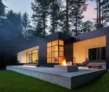 Minimalist Black and White Forest House Facade with Panoramic Windows