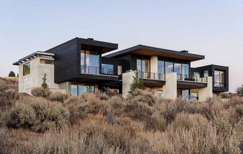 Modern countryside house with contrasting facade on hilly terrain