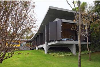 Modern suspended façade with dynamic louvers and brutalist concrete elements