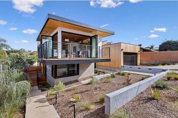 Modern two-story house with minimalist concrete and wood facade