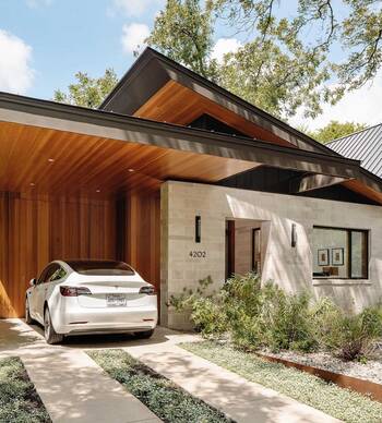 Modern facade with wooden canopy: stone and wood combination in minimalist design