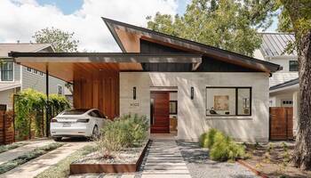 Modern Facade with Asymmetrical Roof: Harmony of Stone and Wood