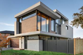 Modern Minimalist Façade with Contrasting White Stucco and Wooden Slats