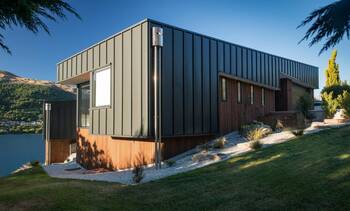 Modern minimalist facade with contrasting metal and wood combination