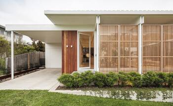 Modern Minimalist Facade with Wooden Lattice Panels