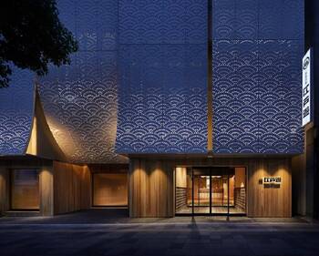 Japanese Minimalism: Perforated Facade with Night Illumination