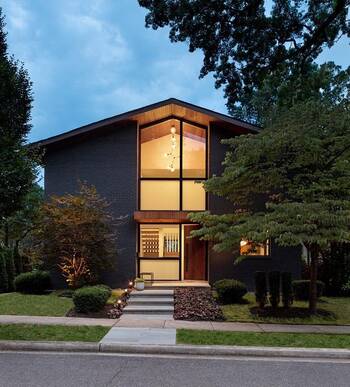 Modern Minimalist Facade with Contrasting Brick and Wood Finish