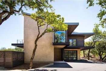 Minimalist façade of a modern home with integrated natural elements