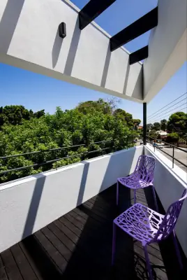 Modern balcony with minimalist façade and contrasting accents