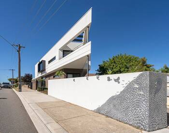 Dynamic Modern Facade with Triangular Geometry and Artistic Boundary Wall