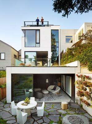 Contemporary Minimalist Façade of a Multi-Level House with Panoramic Glazing