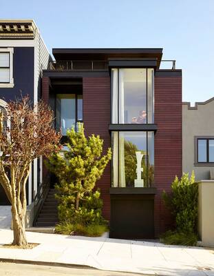 Modern urban house with burgundy wooden facade and panoramic glazing